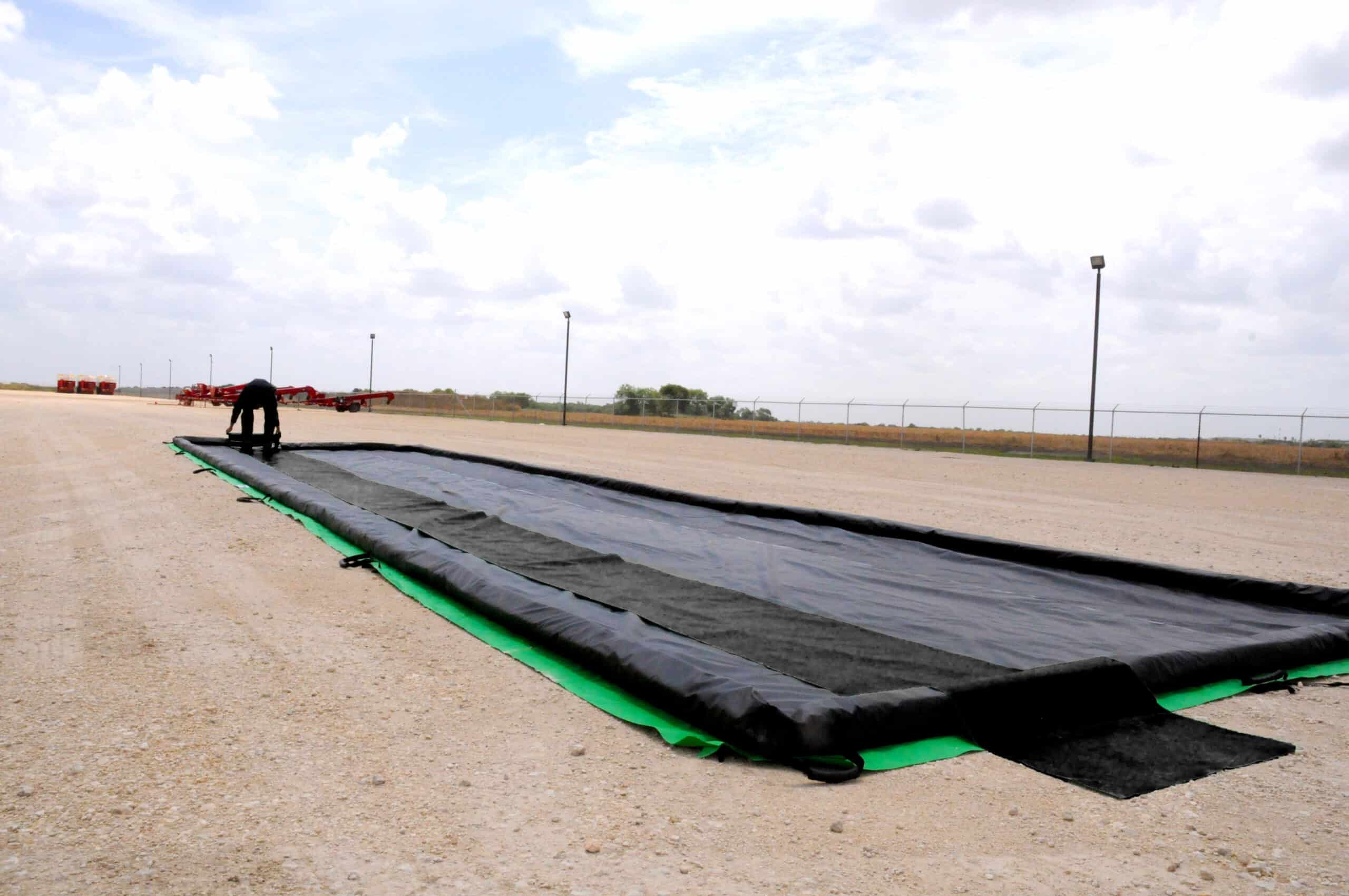 UltraTech's Must - Have Ground Tarps & Track Belts for Ultra - Containment Berms